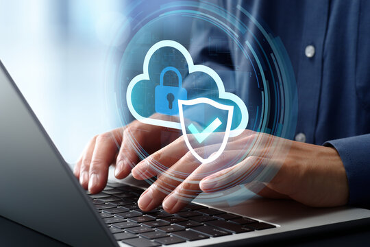 Secure cloud security solution. Data protection and encryption. Shield and check mark icon. Businessman using laptop computer.