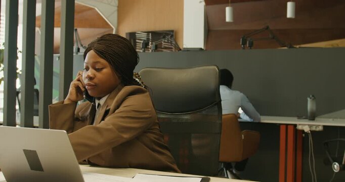 Professional multitasking scene. Businesswoman managing calls and documents