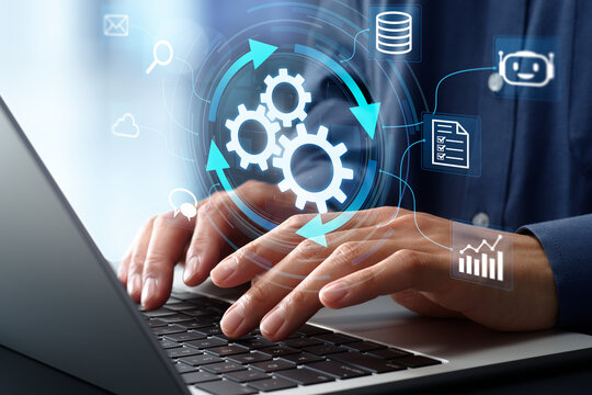 Business efficiency and productivity with automation technology. Business workflow improvement. Businessman using intelligent business system on laptop computer.