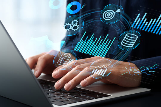 Data-driven decision making and business analytics. Data intelligence and insights. Businessman viewing graphs and charts on laptop computer.