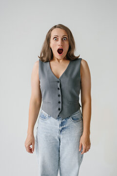 Shocked Woman Screaming with Mouth Open in Studio