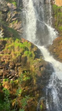 Kamishlinsky waterfall in Altai Republic near Chemal with wooden viewing platform Russia