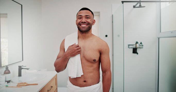 Happy man, portrait and shower with towel in bathroom for hygiene, grooming or cleanliness in home. Male person, skincare or shirtless with smile for morning routine, health or wellness in house