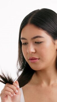 Split ends, beauty and hair with woman in studio for self care, growth fail and worry. Keratin treatment crisis, stress and repair problem with person on white background for elasticity and check