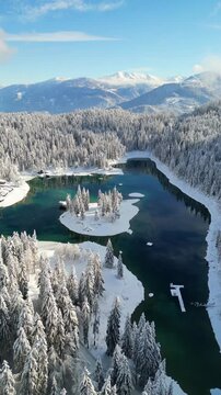 Caumasee Lag la Cauma turquoise-colored alpine lake in Flims, Switzerland winter snow covered