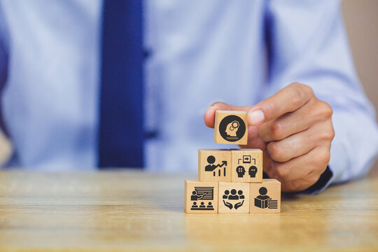 Human resource training and development concept.Business, personal development improving and enhancing competency, performance..Putting wooden cubes training with brainstorm, coaching, learning icons.