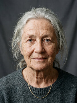 Studio portrait of an elderly person with subtle scars and natural skin details, useful for advanced retouching and realistic skin editing practice.