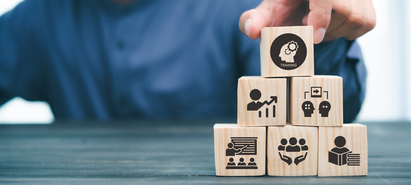 Human resource training and development concept.Business, personal development improving and enhancing competency, performance..Putting wooden cubes training with brainstorm, coaching, learning icons.