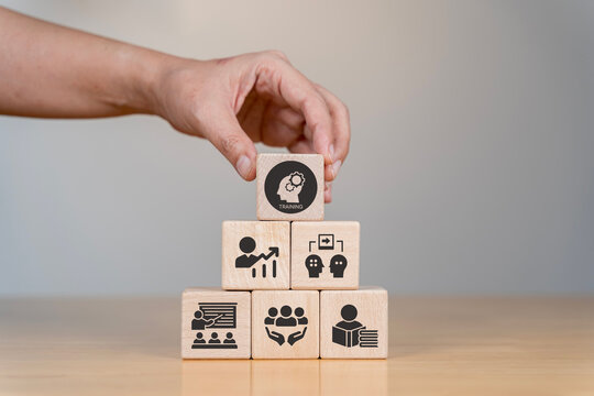 Human resource training and development concept.Business, personal development improving and enhancing competency, performance..Putting wooden cubes training with brainstorm, coaching, learning icons.