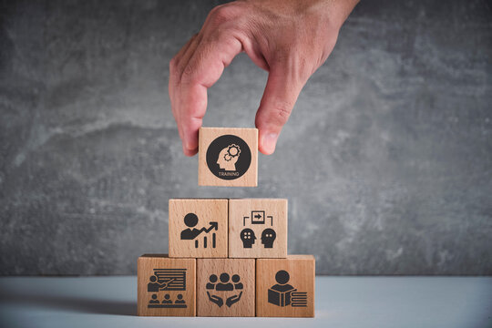 Human resource training and development concept.Business, personal development improving and enhancing competency, performance..Putting wooden cubes training with brainstorm, coaching, learning icons.