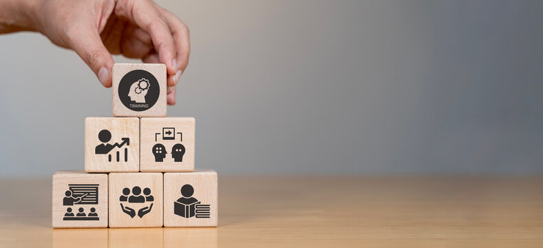Human resource training and development concept.Business, personal development improving and enhancing competency, performance..Putting wooden cubes training with brainstorm, coaching, learning icons.
