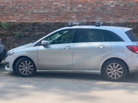 Mercedes Benz B Class silver compact car with roof rack for family travel and urban transport