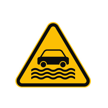 A yellow triangular warning sign depicting a car driving through water.