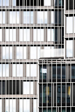 Urban building exterior detail with modern architecture facade windows and abstract pattern symmetry lines grid texture in minimal design