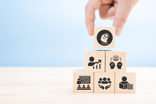 Human resource training and development concept.Business, personal development improving and enhancing competency, performance..Putting wooden cubes training with brainstorm, coaching, learning icons.
