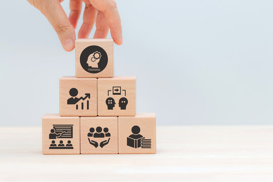 Human resource training and development concept.Business, personal development improving and enhancing competency, performance..Putting wooden cubes training with brainstorm, coaching, learning icons.