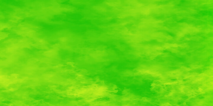 Vibrant green cloudy background texture with soft yellow undertones for graphic design, old style green texture background for making fabric pattern, web design ,card, cover and decoration.	