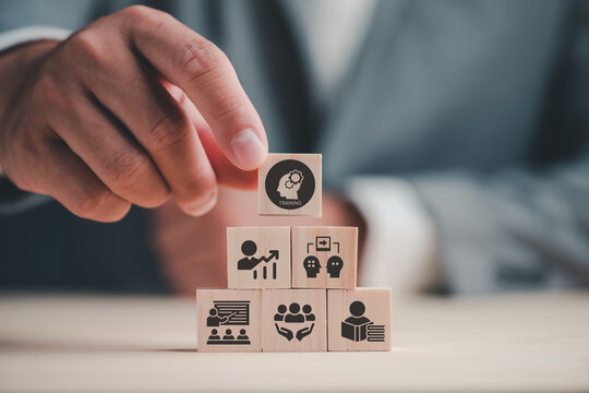 Human resource training and development concept.Business, personal development improving and enhancing competency, performance..Putting wooden cubes training with brainstorm, coaching, learning icons.