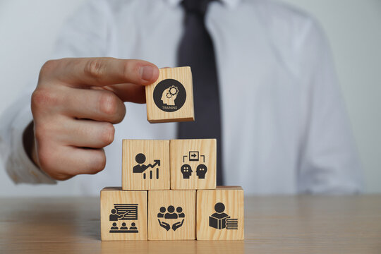 Human resource training and development concept.Business, personal development improving and enhancing competency, performance..Putting wooden cubes training with brainstorm, coaching, learning icons.