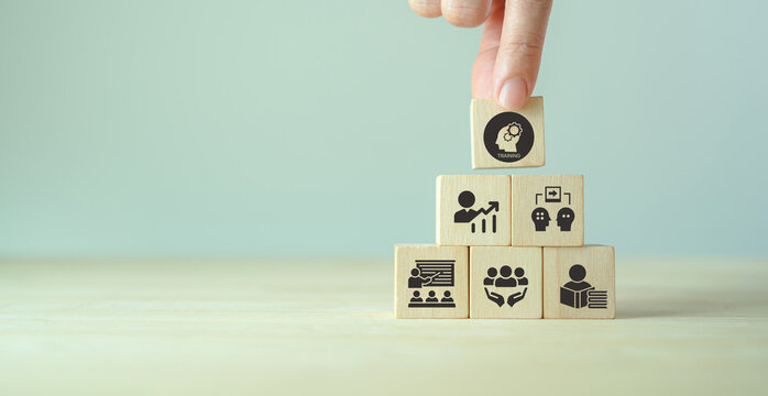 Human resource training and development concept.Business, personal development improving and enhancing competency, performance..Putting wooden cubes training with brainstorm, coaching, learning icons.