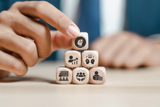 Human resource training and development concept.Business, personal development improving and enhancing competency, performance..Putting wooden cubes training with brainstorm, coaching, learning icons.
