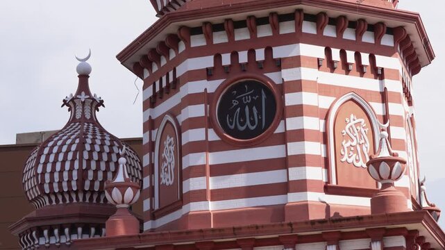 Close-up of the domes of Jami Ul-Alfar Mosque, known as the &ldquo;Red Mosque,&rdquo; in Colombo, Sri Lanka, highlighting its distinctive architectural details