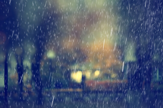 Background photo of rain in an evening park, drops moving in blur, weather changing