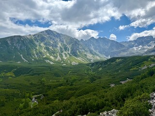 Fototapeta premium Mountain peaks with green valleys