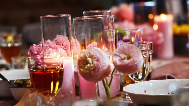 Decorated table setup with flowers and drinks at a gathering
