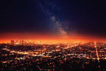 Fototapeta premium Milky way glowing over los angeles city lights at night
