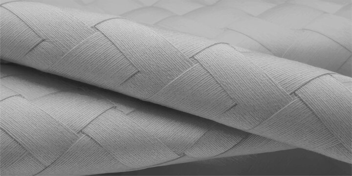Close-up view of woven textile, showing intricate basket-weave design with smooth texture and soft folds. 