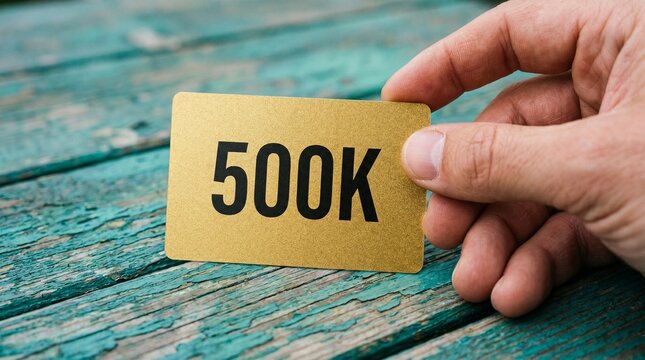 Gold Credit Card with 500K Credit Limit in Hand	hand,
