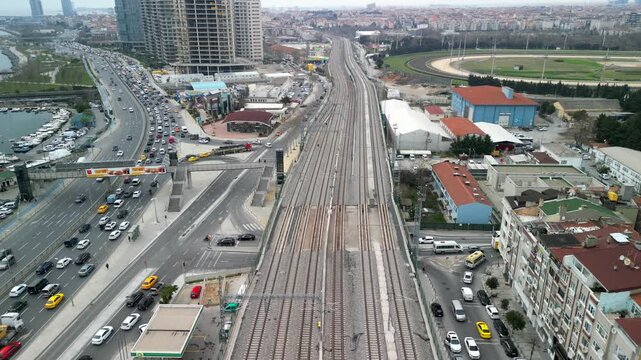 Empty railroad tracks of metro in Istanbul Turkey, with highway by the side