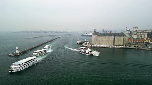 Istanbul/Turkey circa 2023: Drone shot of ferries near the shore