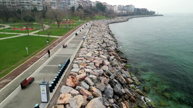 Park recreational area with a sea view, slow drone shot