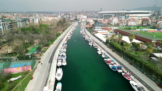 Istanbul/Turkey circa 2023: Kadikoy Park and boat parking at the river bank