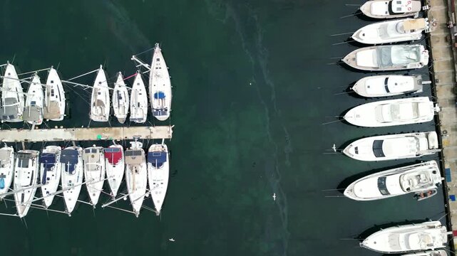 Drone shot of boats parked at marina docks