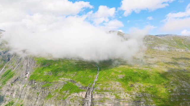 Aerial drone shot of the scenic fjord in Norway. Scandinavian nature. High mountains and deep fjords in the north. Concept of travel, vacation and arctic nature.

