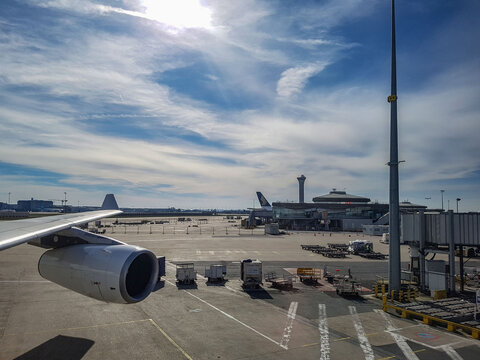 Paris, France - March 11, 2017 - the view of Singapore Airlines and air traffic control tower of paris charles de gaulle airport and airbus a340 engine and wing