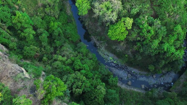 Wide Establishing Shot expansive golden countryside view with curvy dry river Near Mt. Batulao, Balayan, Batangas, Philippines