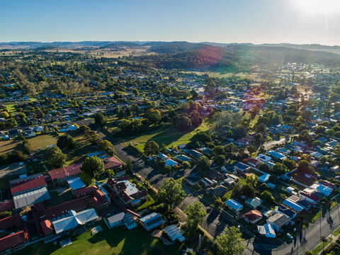 Neat town planning shown in aerial view over rural town in bright summer sunshine
