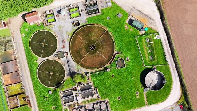 Aerial satellite view of sewerage farm with camera rotating with machinery