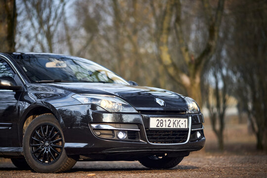 Minsk, Belarus - March, 17 2026: Renault Laguna III 3rd generation 1.5 dCi restyling liftback car parked on street in spring front three quarter view.