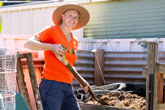 Australian woman in backyard garden ready to turn `
