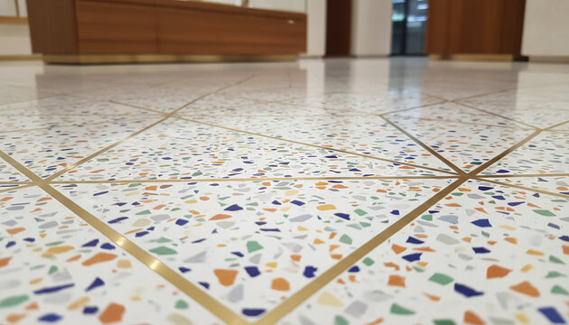 Bespoke Terrazzo flooring texture with geometric brass inlay strips