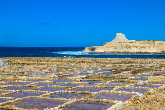 Beautiful view of white hillrock Qolla l-Bajda, also known as Xwejni Rock and Xwejni Salt Pans near Marsalforn on the island of Gozo, Malta