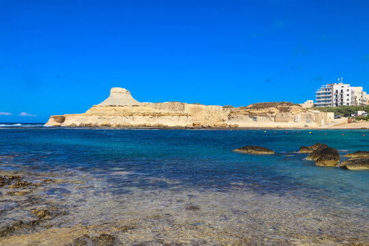 Beautiful view of white hillrock Qolla l-Bajda, also known as Xwejni Rock near Marsalforn on the island of Gozo, Malta