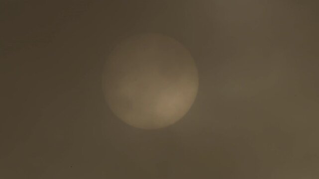 Sun with calima or kalima