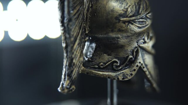 Detailed bronze helmet spin, gladiator armor macro, studio lighting and reflections 120 FPS Slow motion