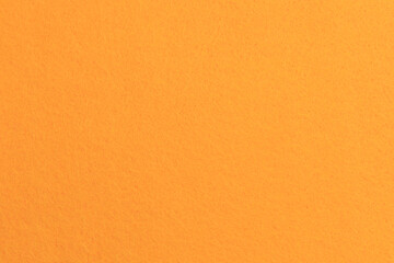 Naklejka premium Bright orange background with texture for various creative projects and designs in different lighting conditions
